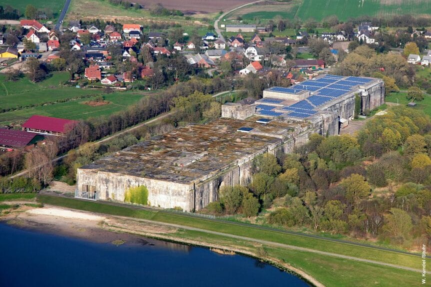 Aerial view of Bunker Valentin by the water in Rekum with a countryside village in the background