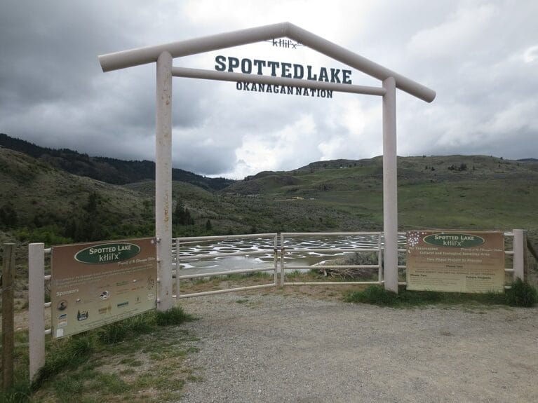 The gateway to the Spotted Lake with a sign indicating it’s under the protection of the Okanagan Nation Alliance, in British Columbia, Canada.