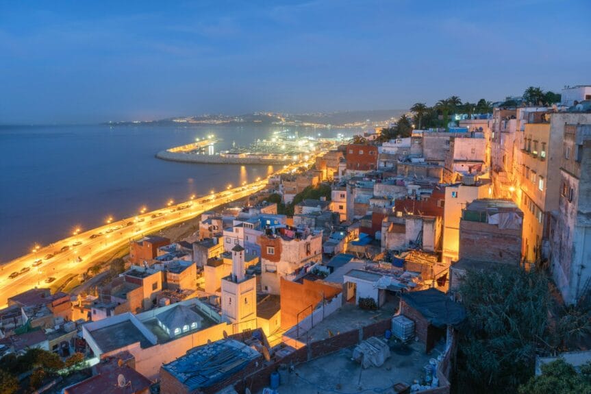 View of the medina in Tangier, Morocco, near the shore at night time.