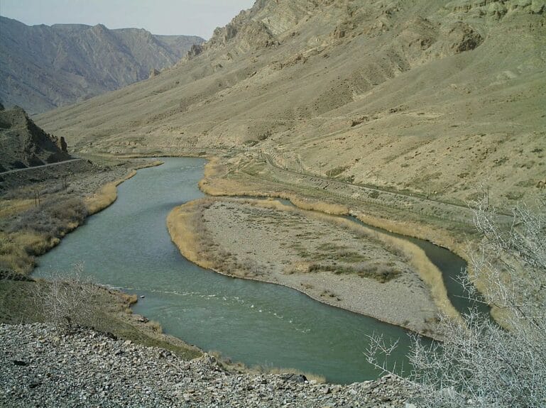 A long stretch of river in between landscapes and mountains in Azerbaijan.