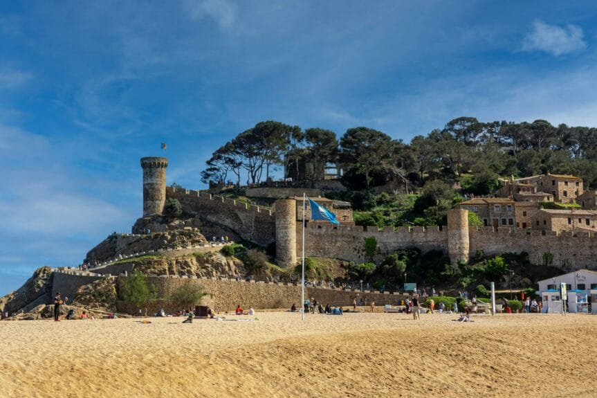 View of the Fortress of Tossa de Mar from the edge of the hillside beach in Spain.