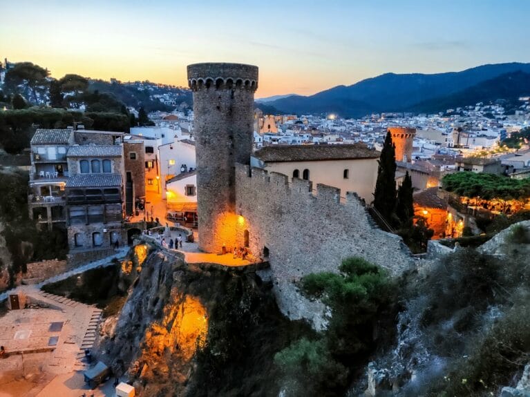 Tossa de Mar and the ancient fortress wall at nightfall with all the city lights.