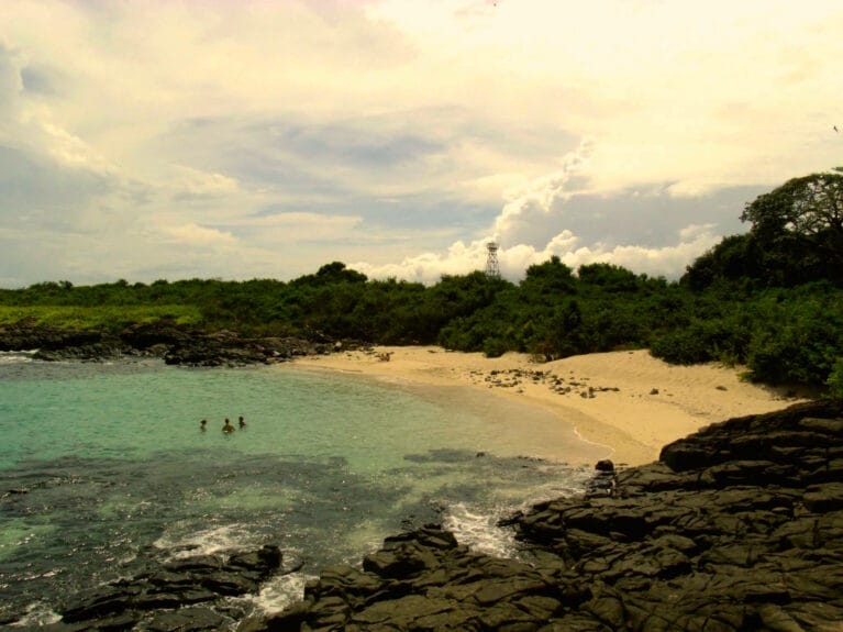 A group of people swimming at the beach in Isla Iguana, Panama.