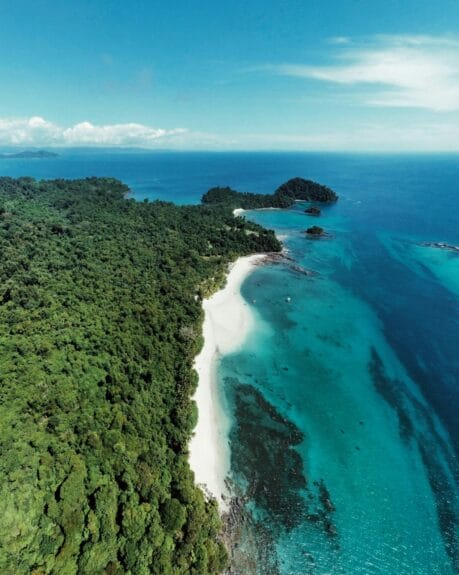 Aerial view of Isla Coiba with a sand beach in Panama.