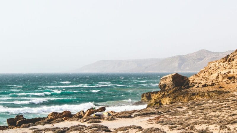 A rocky seashore in the daytime in Morocco.