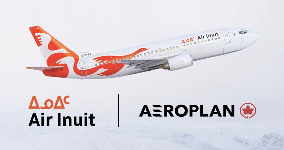 Avion d’Air Inuit en vol avec les logos du partenariat Aeroplan.